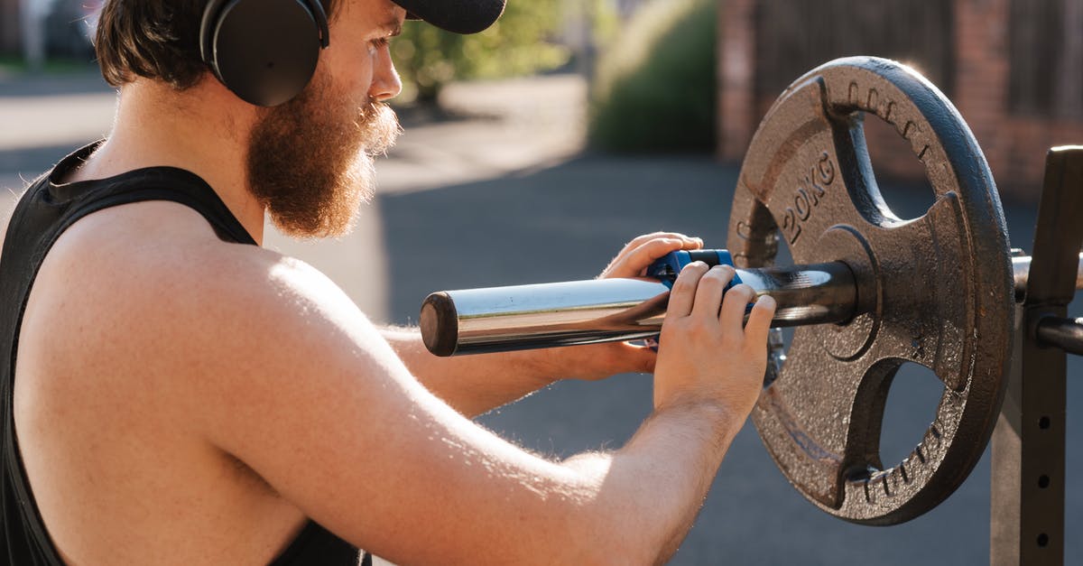 Cracks Developing in Straight-Sided Stainless Steel Vessels - Crop hipster sportsman preparing barbell before exercising on street Cracks Developing in Straight-Sided Stainless Steel Vessels - Crop hipster sportsman preparing barbell before exercising on street
