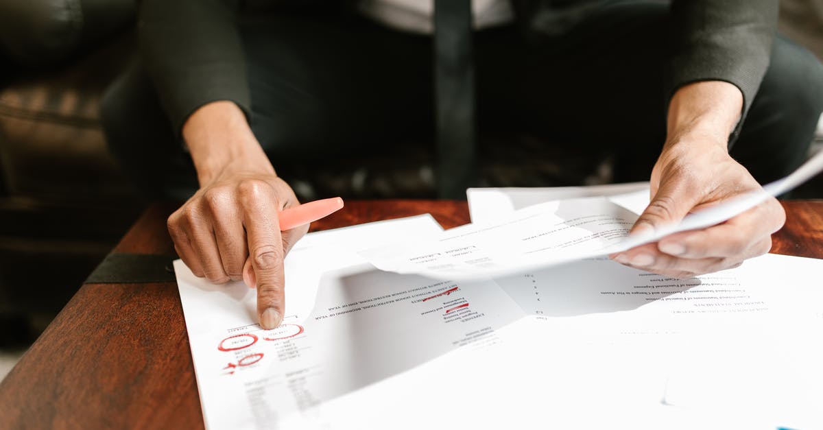 Creamer returns - Close-up Photo of Person pointing on Documents Creamer returns - Close-up Photo of Person pointing on Documents