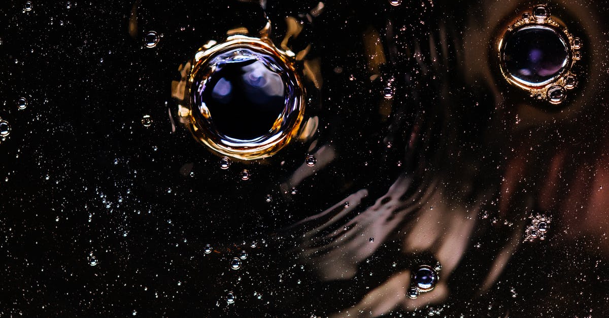 Create a water + baking soda solution? - Bubbles and ripples on dark drink surface Create a water + baking soda solution? - Bubbles and ripples on dark drink surface