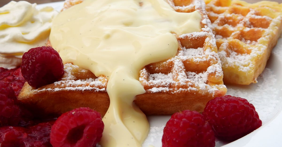 Crepes sliding off crepe maker base - Plate of Waffles and Raspberries Crepes sliding off crepe maker base - Plate of Waffles and Raspberries
