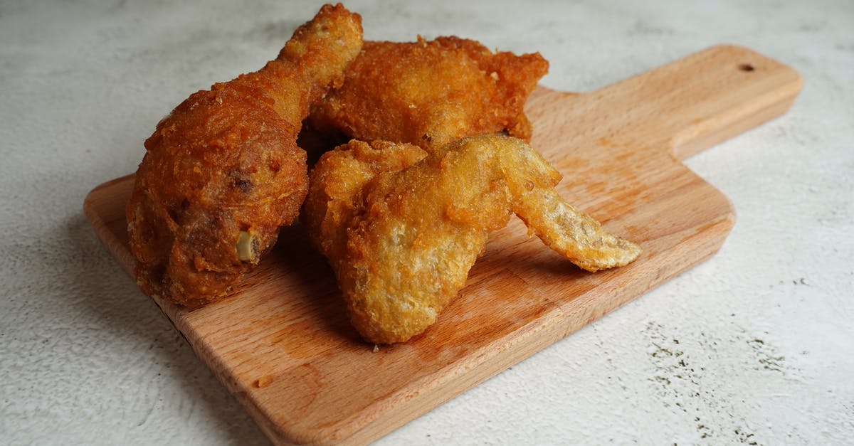 Crispy stir-fried mushrooms - Fried Chicken on a Wooden Cutting Board Crispy stir-fried mushrooms - Fried Chicken on a Wooden Cutting Board