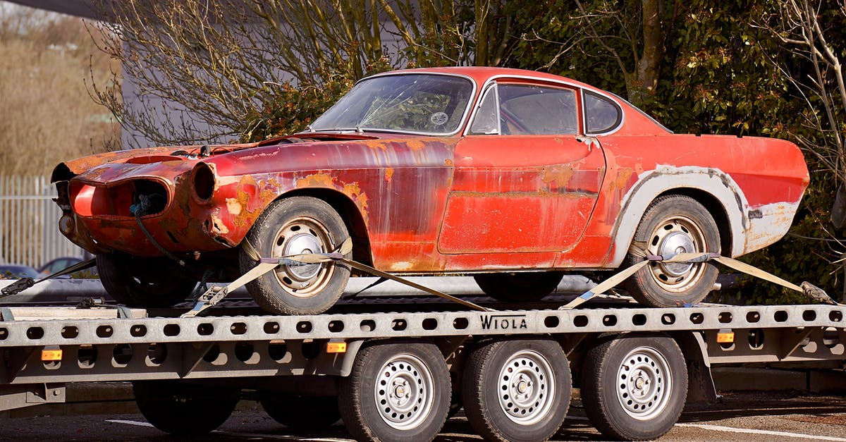 Crockpot is cracked - Red Coupe on Flatbed Trailer Crockpot is cracked - Red Coupe on Flatbed Trailer
