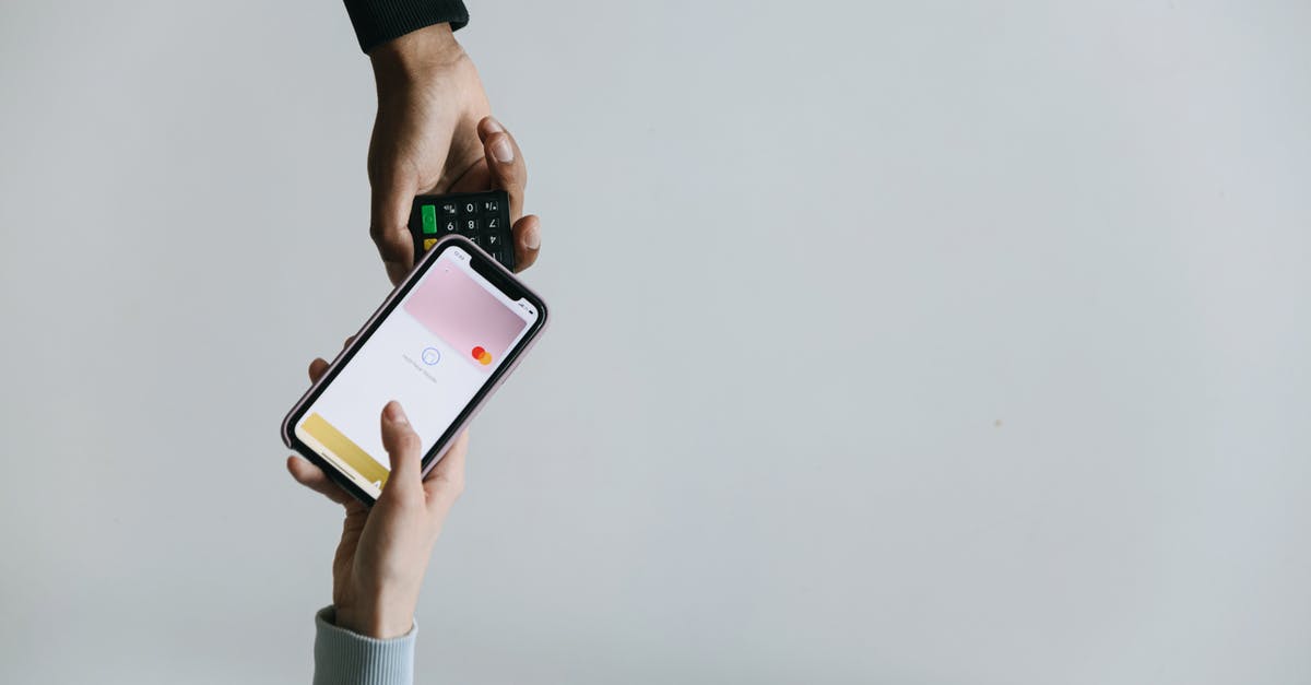 Curries as receptors of odor transfer in refrigirators - A Person Paying using a Smartphone Curries as receptors of odor transfer in refrigirators - A Person Paying using a Smartphone