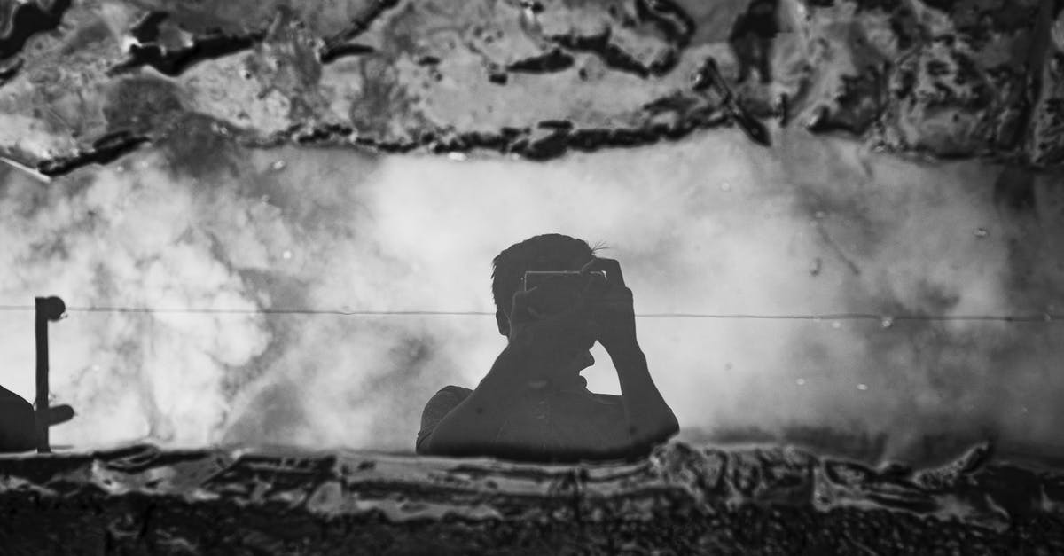 Danger From French Press Wire Mesh? - Faceless photographer taking photo of puddle between dirt on camera Danger From French Press Wire Mesh? - Faceless photographer taking photo of puddle between dirt on camera