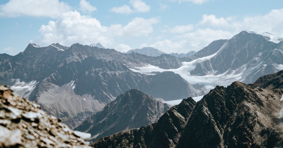 Dealing with frozen ground beef - Picturesque scenery of rough rocky mountain tops covered with snow located highland under cloudy sky Dealing with frozen ground beef - Picturesque scenery of rough rocky mountain tops covered with snow located highland under cloudy sky