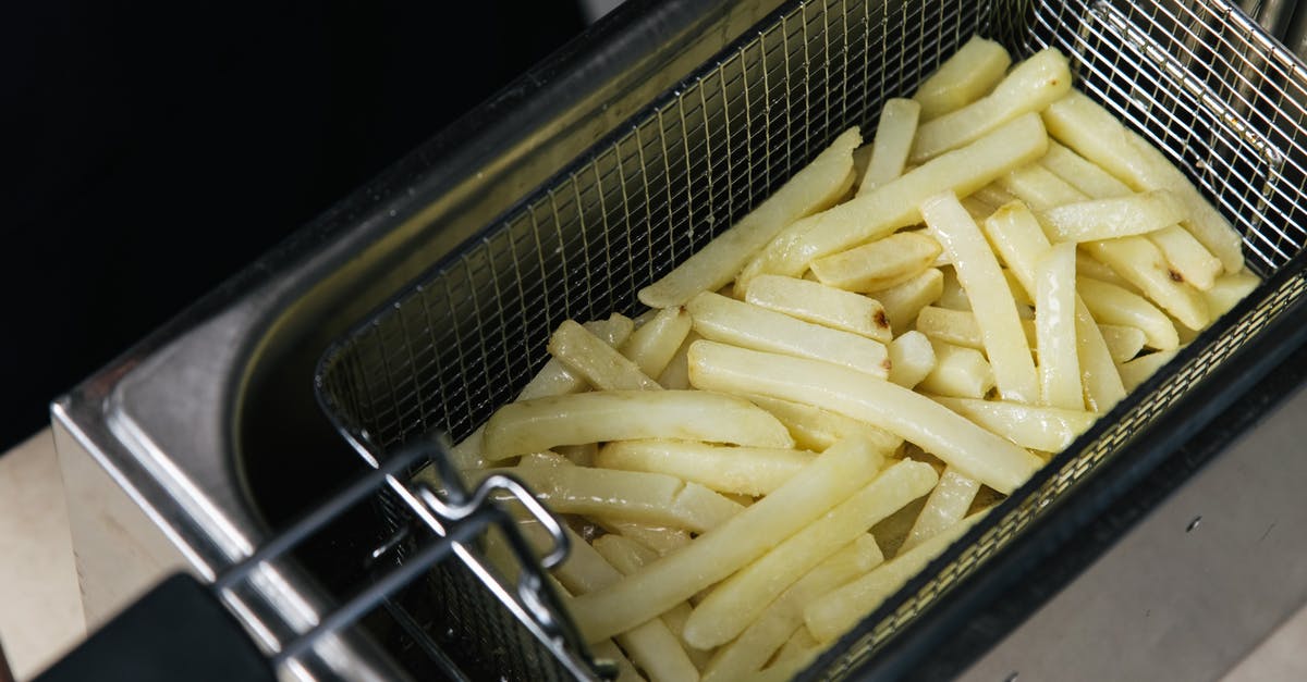 Deep frying vs air frying temperature equivalence - Close-Up Shot of Deep Frying French Fries Deep frying vs air frying temperature equivalence - Close-Up Shot of Deep Frying French Fries