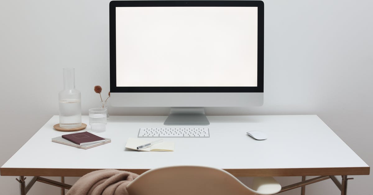 Device to install on a bottle to only spill drops - Stylish workspace with computer and simple furniture Device to install on a bottle to only spill drops - Stylish workspace with computer and simple furniture