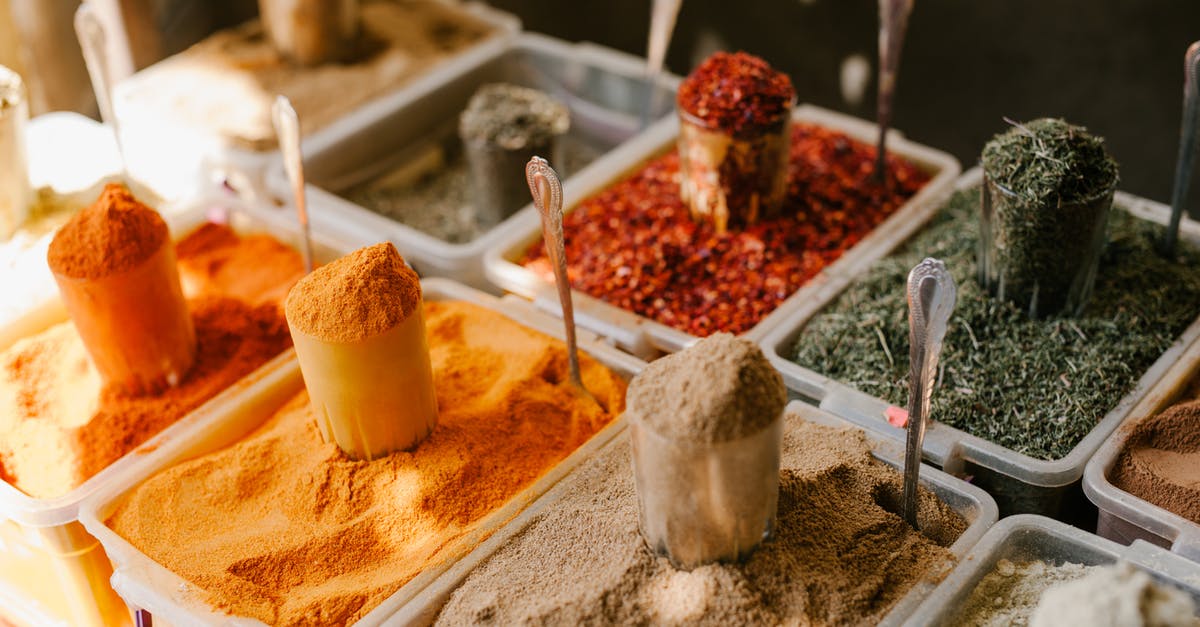 Difference between curry and tikka masala? - Assorted spices at counter in street market Difference between curry and tikka masala? - Assorted spices at counter in street market