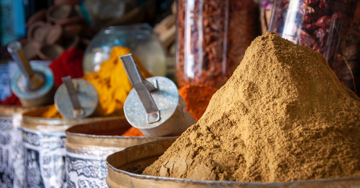 Difference between curry and tikka masala? - Various colorful spices in local market on sunny day Difference between curry and tikka masala? - Various colorful spices in local market on sunny day