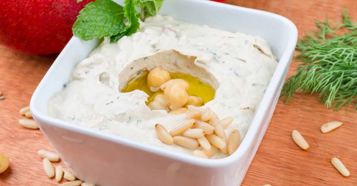 Difference between tzatziki and Indian mint dip (mint chutney?) - White Ceramic Bowl With Yellow Soup Difference between tzatziki and Indian mint dip (mint chutney?) - White Ceramic Bowl With Yellow Soup
