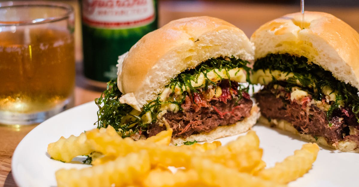Difference between Welsh rabbit and beer cheese dip - French Fries and Slice Hamburger on Plate Difference between Welsh rabbit and beer cheese dip - French Fries and Slice Hamburger on Plate