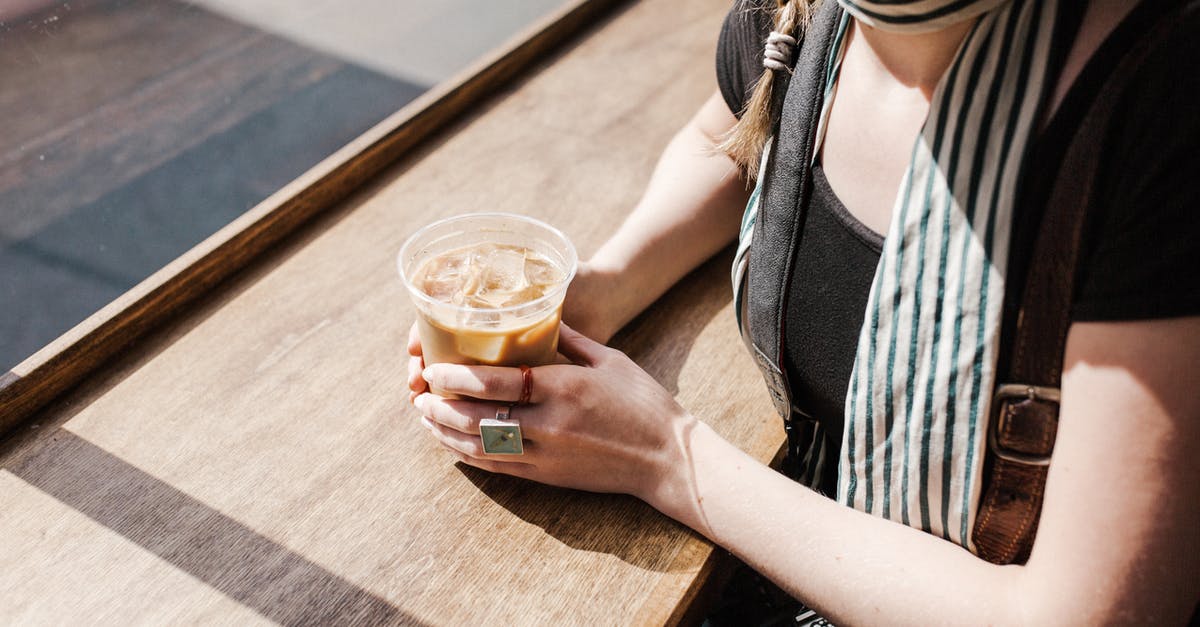Difference in caffeine levels between light and bold coffee? - Person Holding Iced Coffee Difference in caffeine levels between light and bold coffee? - Person Holding Iced Coffee