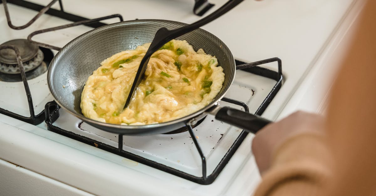 Difference in technique for cooking with non-stick and standard pans? - Person Cooking on Black Frying Pan Difference in technique for cooking with non-stick and standard pans? - Person Cooking on Black Frying Pan