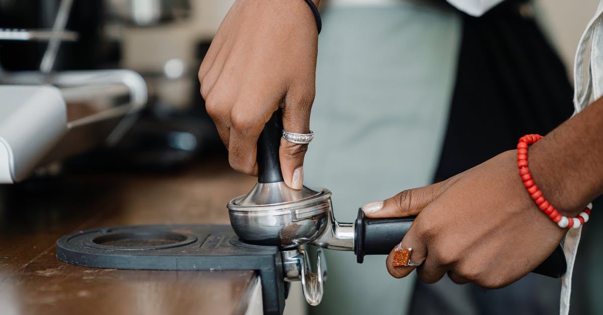 Differences between coffee made with french press or espresso machine? - Crop barista making fresh delicious coffee using professional machine Differences between coffee made with french press or espresso machine? - Crop barista making fresh delicious coffee using professional machine