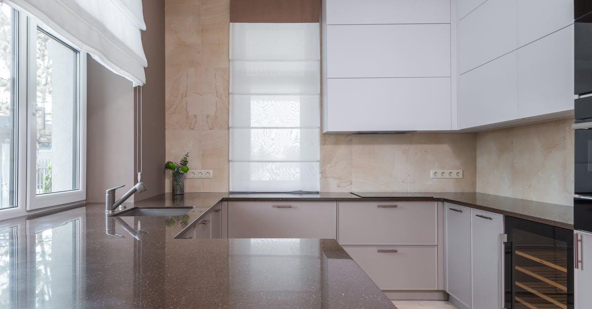 Differences between the oven stone and the pizza oven? - Kitchen interior with light furniture Differences between the oven stone and the pizza oven? - Kitchen interior with light furniture