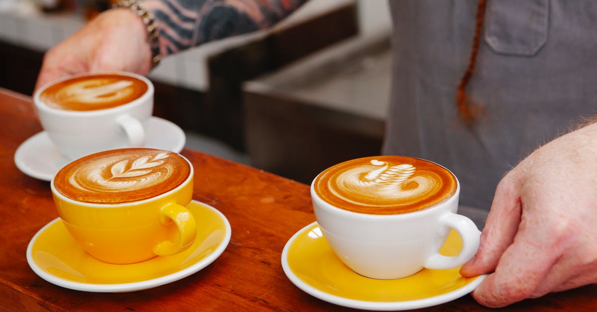 Differences between types of Italian coffee [duplicate] - Crop barista with cups of delicious coffee in cafe