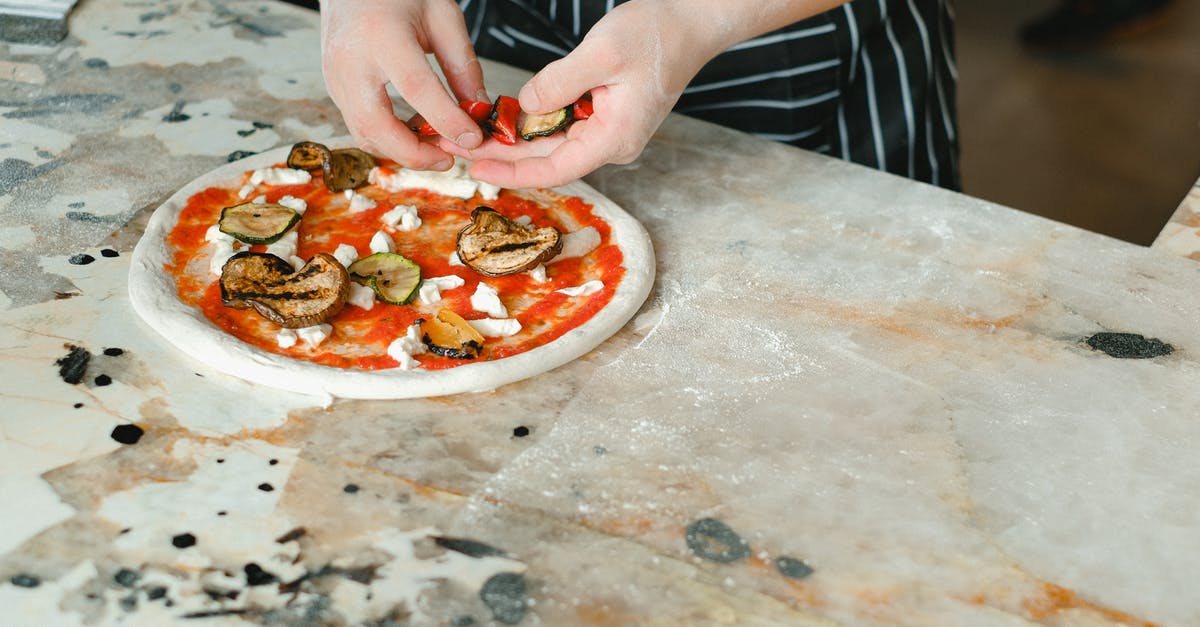 Dividing Pizza dough to balls before baking - A Chef Toppings Pizza with Vegetables