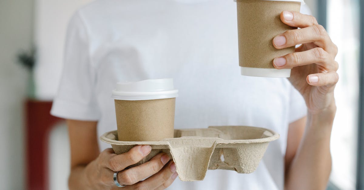 Do coffee and tea need to be agitated while brewing? - Crop female enjoying takeaway coffee Do coffee and tea need to be agitated while brewing? - Crop female enjoying takeaway coffee