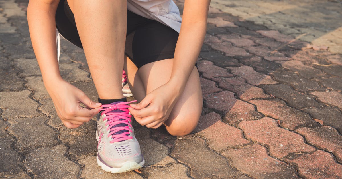 Do I have to tie my turkey legs together? - Woman Lacing Up Her Gray and Pink Nike Low-top Athletic Shoe Do I have to tie my turkey legs together? - Woman Lacing Up Her Gray and Pink Nike Low-top Athletic Shoe