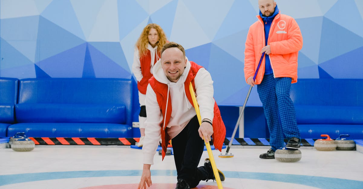 Do I have to wait for frozen steak to defrost? - Cheerful sportsman playing in curling in ice rink Do I have to wait for frozen steak to defrost? - Cheerful sportsman playing in curling in ice rink