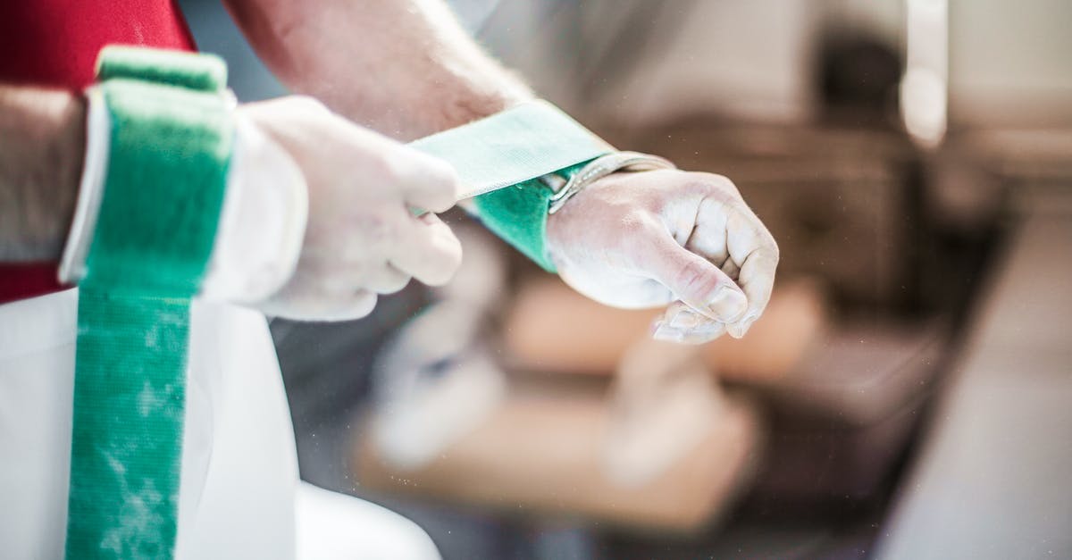 Do I need special gloves for mozzarella stretching? - Crop sportsman wearing wrist support band Do I need special gloves for mozzarella stretching? - Crop sportsman wearing wrist support band