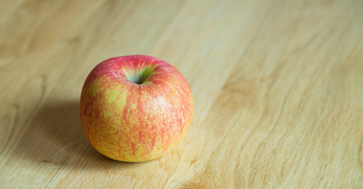 Do I need to peel a red kuri squash? - From above of delicious whole juicy apple with red and yellow peel on desk Do I need to peel a red kuri squash? - From above of delicious whole juicy apple with red and yellow peel on desk