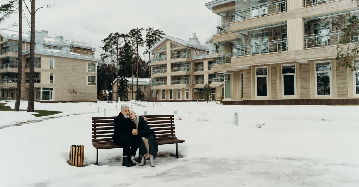 Do I need to season an old cast-aluminum pan? - Photo of an Elderly Couple Sitting on a Wooden Bench