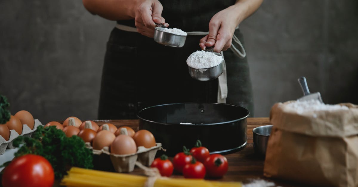 Do I need to sift flour for quick breads? - Crop faceless person in black apron standing near counter and adding flour in bowl while making homemade pasta with eggs and spaghetti near tomatoes and herbs Do I need to sift flour for quick breads? - Crop faceless person in black apron standing near counter and adding flour in bowl while making homemade pasta with eggs and spaghetti near tomatoes and herbs