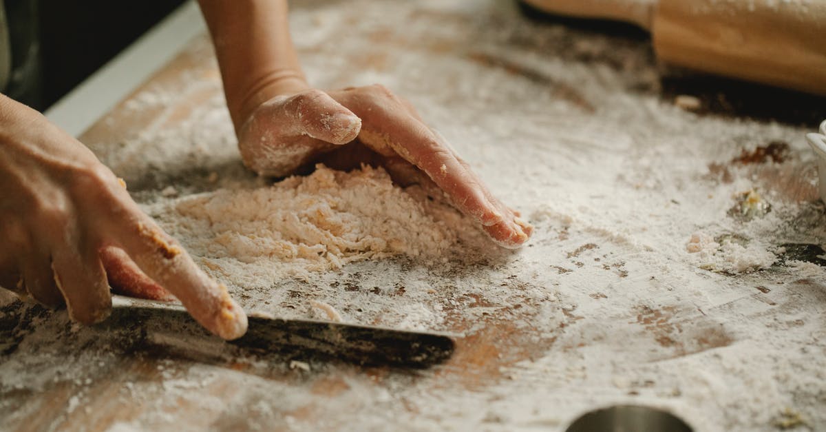 Do I really need pastry flour in my molasses cookie recipe? - High angle of unrecognizable woman cutting dough on cutting board on table in kitchen Do I really need pastry flour in my molasses cookie recipe? - High angle of unrecognizable woman cutting dough on cutting board on table in kitchen