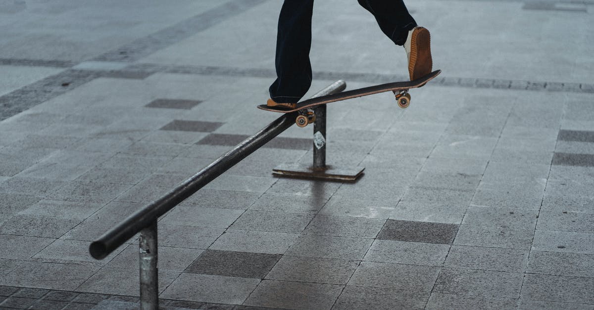 Do induction cookers increase risk of cracking cast iron? - Back view of crop anonymous male in jeans showing trick with skateboard on iron railing placed on concrete tile Do induction cookers increase risk of cracking cast iron? - Back view of crop anonymous male in jeans showing trick with skateboard on iron railing placed on concrete tile