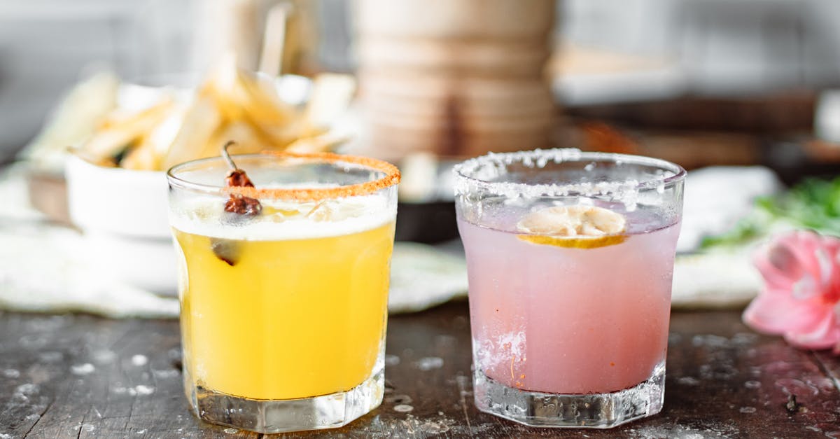 Do Liquor Based Extracts Require Sugar? - Two Clear Drinking Glasses With Pink and Yellow Liquid Do Liquor Based Extracts Require Sugar? - Two Clear Drinking Glasses With Pink and Yellow Liquid