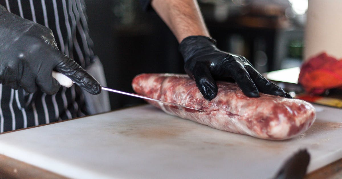Do meat grinders need to have cutting blade - Person Slicing a Raw Meat Do meat grinders need to have cutting blade - Person Slicing a Raw Meat