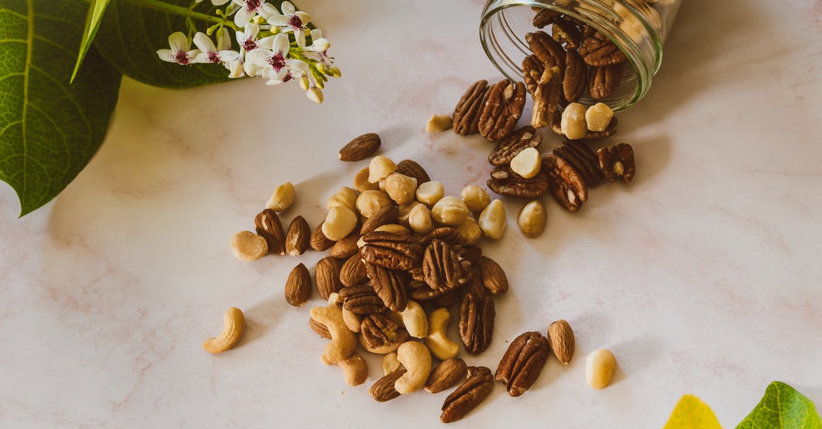 Do nuts ever go bad? - Brown and Beige Nuts on White Table Do nuts ever go bad? - Brown and Beige Nuts on White Table