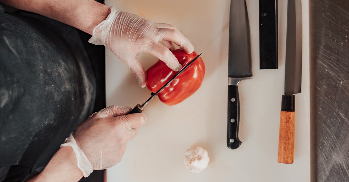Do "Chinese Ironwood" cutting boards dull knives quickly? - Person Cutting a Red Pepper Do "Chinese Ironwood" cutting boards dull knives quickly? - Person Cutting a Red Pepper