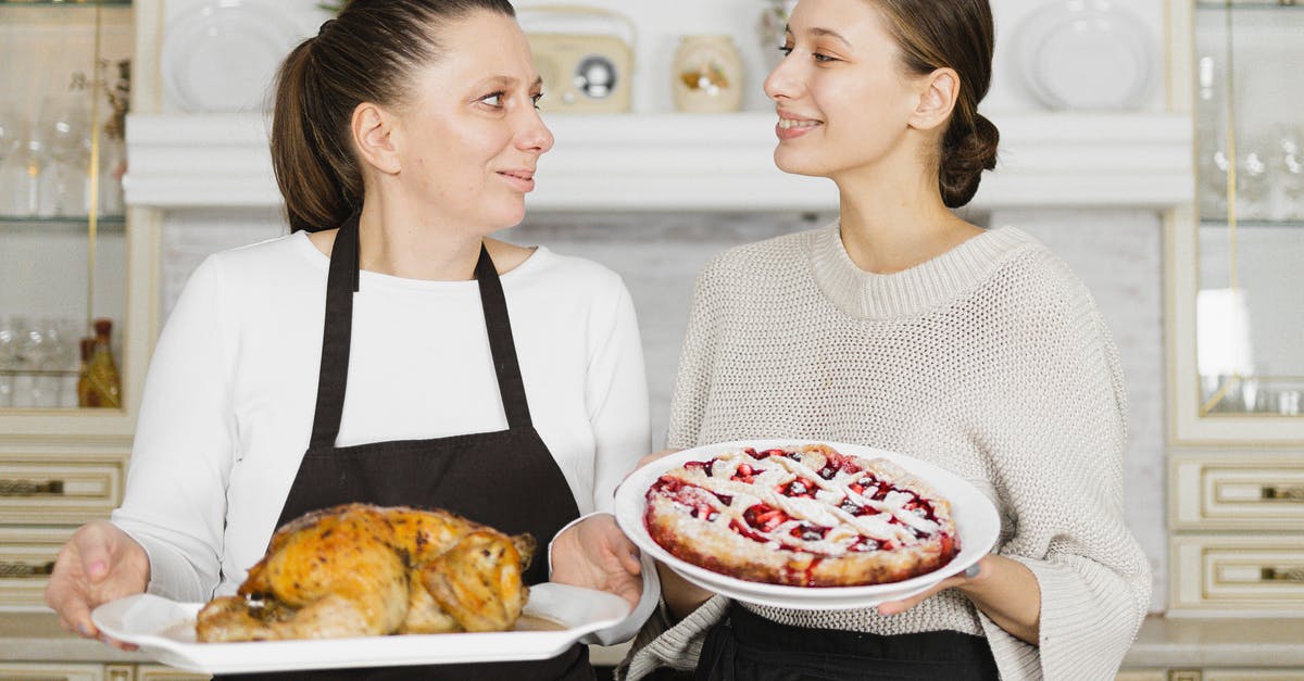 Does a change in altitude affect baking time or temperature? - Mother and Daughter Looking at Each Other while Holding Food Does a change in altitude affect baking time or temperature? - Mother and Daughter Looking at Each Other while Holding Food