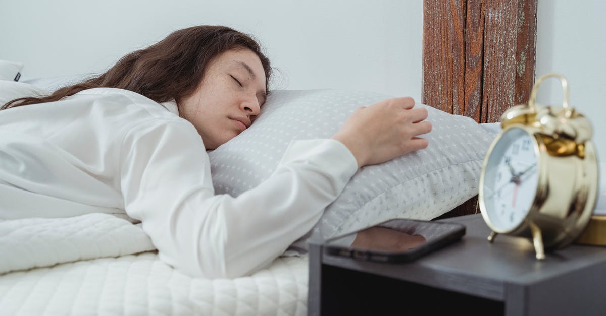 Does a long marinade time matter for chicken, shrimp, etc? - Young woman with dark long wavy hair sleeping peacefully on belly on comfortable bed under white blanket near bedside table with alarm clock and smartphone Does a long marinade time matter for chicken, shrimp, etc? - Young woman with dark long wavy hair sleeping peacefully on belly on comfortable bed under white blanket near bedside table with alarm clock and smartphone