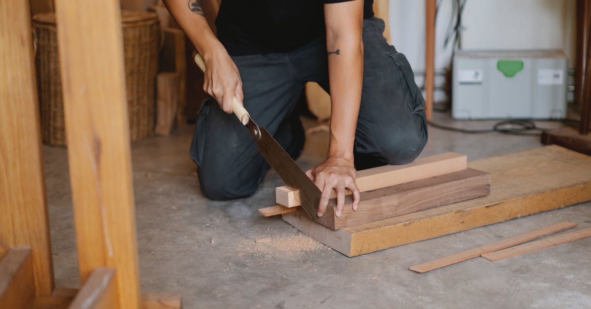 Does a silicone cutting board really work well? - Crop man cutting wood in workshop Does a silicone cutting board really work well? - Crop man cutting wood in workshop