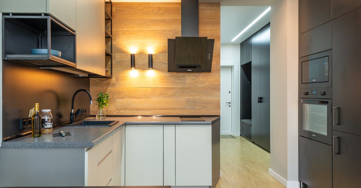 Does an electric crepe maker require a hood and ventilation? - Interior of contemporary kitchen with counter under shelves and cabinets with microwave and oven with hood Does an electric crepe maker require a hood and ventilation? - Interior of contemporary kitchen with counter under shelves and cabinets with microwave and oven with hood