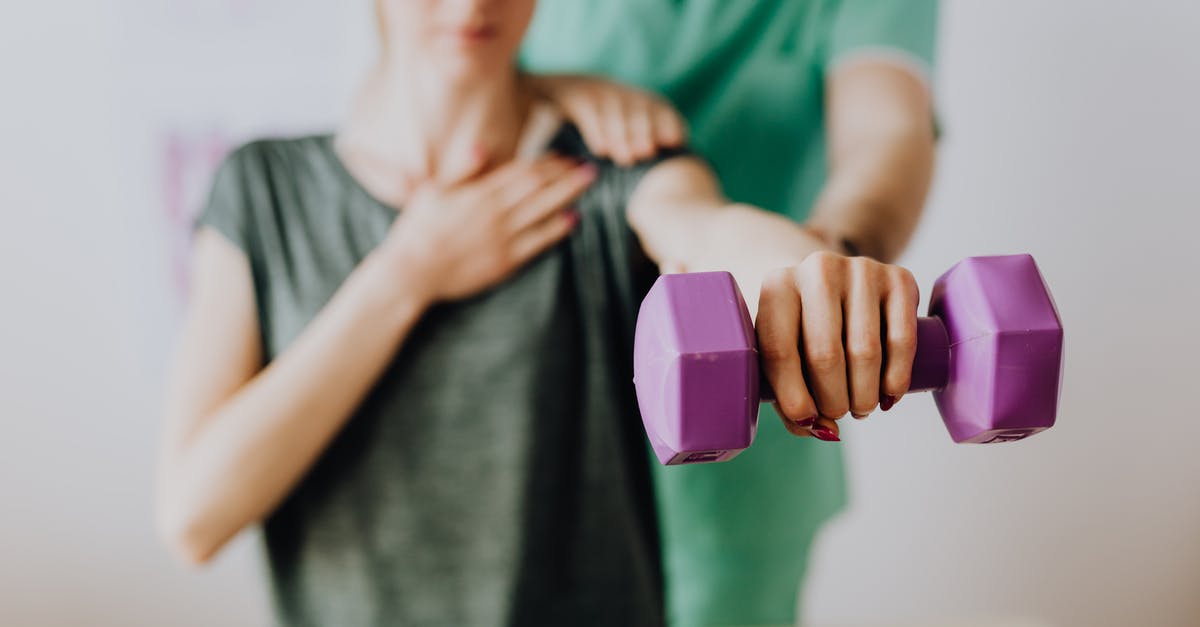 Does Arabic gum help keep frozen yogurt soft? - Crop unrecognizable orthopedist in uniform helping slender female in casual wear reaching arm with dumbbell in doctor office in hospital Does Arabic gum help keep frozen yogurt soft? - Crop unrecognizable orthopedist in uniform helping slender female in casual wear reaching arm with dumbbell in doctor office in hospital