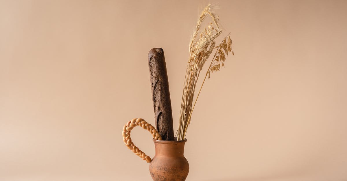 Does baking bread longer dry it out? - Dried Crop and a Baguette on a Clay Vase Does baking bread longer dry it out? - Dried Crop and a Baguette on a Clay Vase