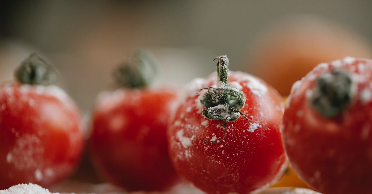 Does bleaching or milling flour remove vitamins? - Fresh red tomatoes in flour prepared for cooking and covered with flour in kitchen in soft focus Does bleaching or milling flour remove vitamins? - Fresh red tomatoes in flour prepared for cooking and covered with flour in kitchen in soft focus