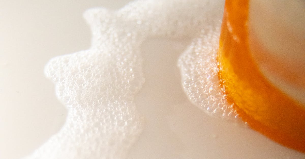 Does bubbly froth mean my vinegar batch needs trashed? - High angle of pile of colorful soaps near foam flow with small bubbles on white surface Does bubbly froth mean my vinegar batch needs trashed? - High angle of pile of colorful soaps near foam flow with small bubbles on white surface