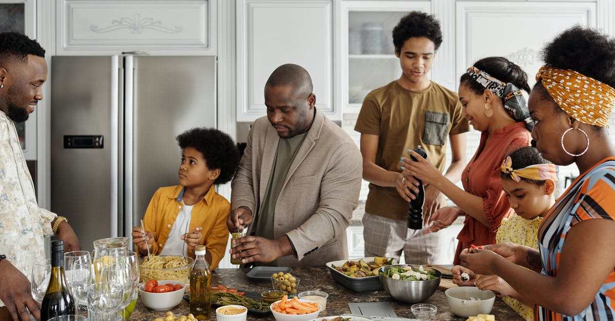 Does cooking wine go bad like regular wine? - Family Preparing Food in the Kitchen