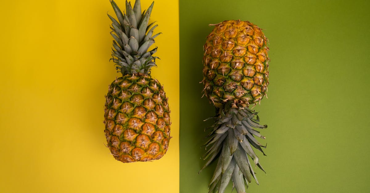 Does cutting off a pineapple's crown shorten its longevity? - Arrangement of ripe pineapples in studio Does cutting off a pineapple's crown shorten its longevity? - Arrangement of ripe pineapples in studio