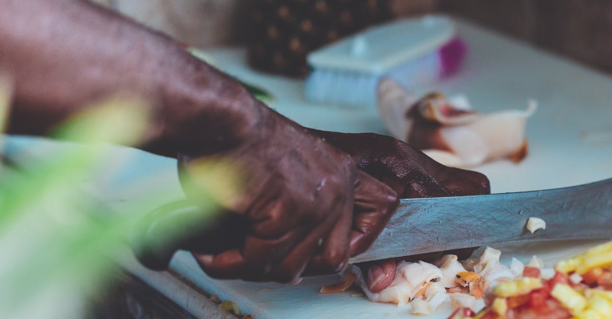 Does cutting off a pineapple's crown shorten its longevity? - Man Chopping Vegetable Does cutting off a pineapple's crown shorten its longevity? - Man Chopping Vegetable