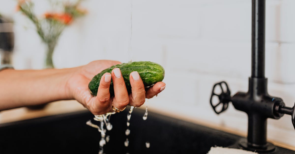 Does dirt sink or rise in boiling water? - Woman Washing Cucumber under Tap Water Does dirt sink or rise in boiling water? - Woman Washing Cucumber under Tap WaterÂ