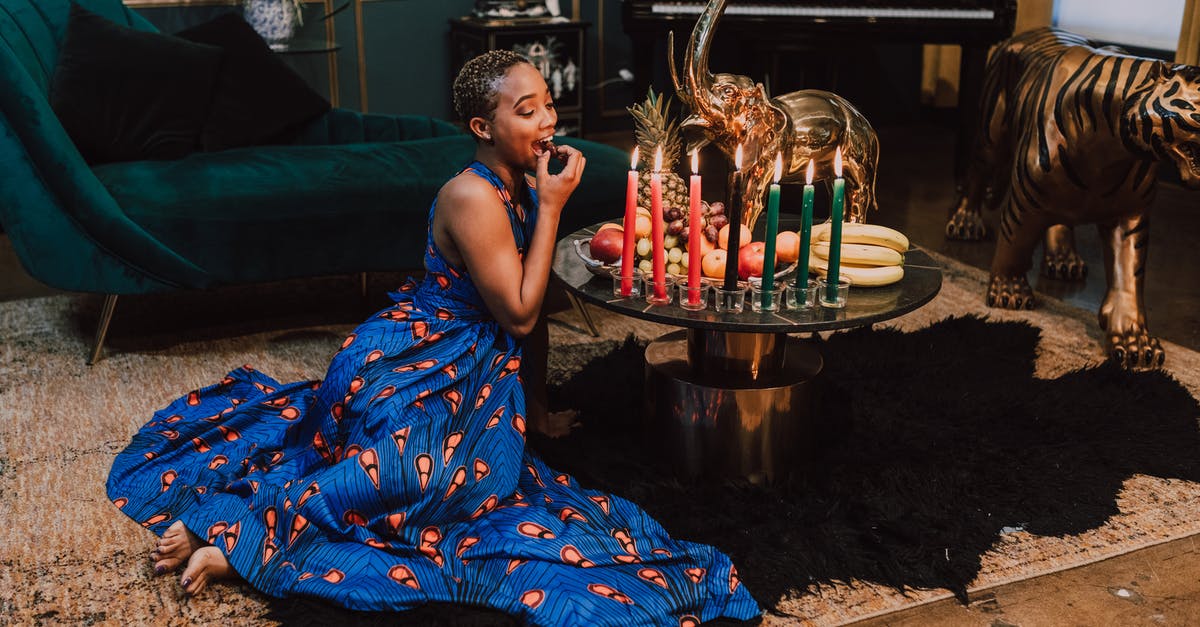 Does eating foods made using transglutaminase pose any risk to your health? [closed] - Woman in Blue Kaftan Dress Eating Fruits
