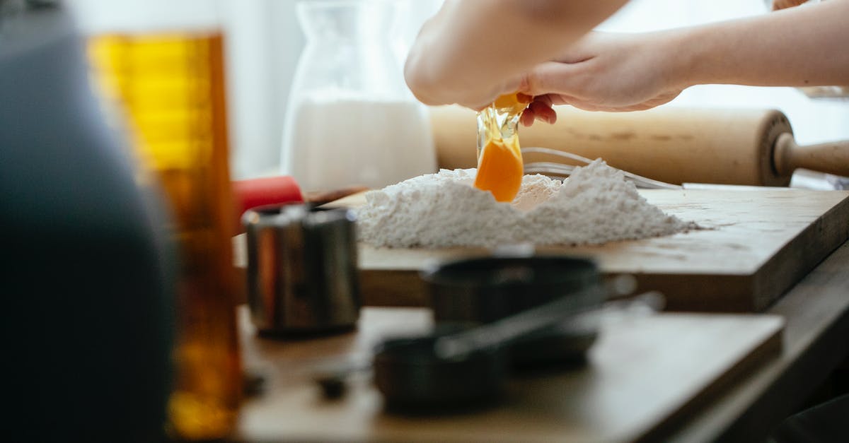 Does handling a lot of flour cause fingernails to break? - Unrecognizable cook breaking egg into pile of flour on wooden board while preparing dough at table in kitchen against blurred background Does handling a lot of flour cause fingernails to break? - Unrecognizable cook breaking egg into pile of flour on wooden board while preparing dough at table in kitchen against blurred background