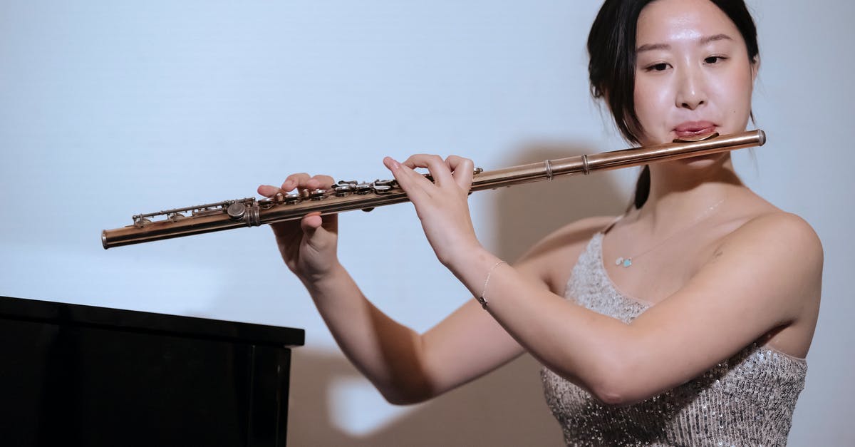 Does kimchi always have live cultures? - Ethnic woman in dress playing flute at concert Does kimchi always have live cultures? - Ethnic woman in dress playing flute at concert