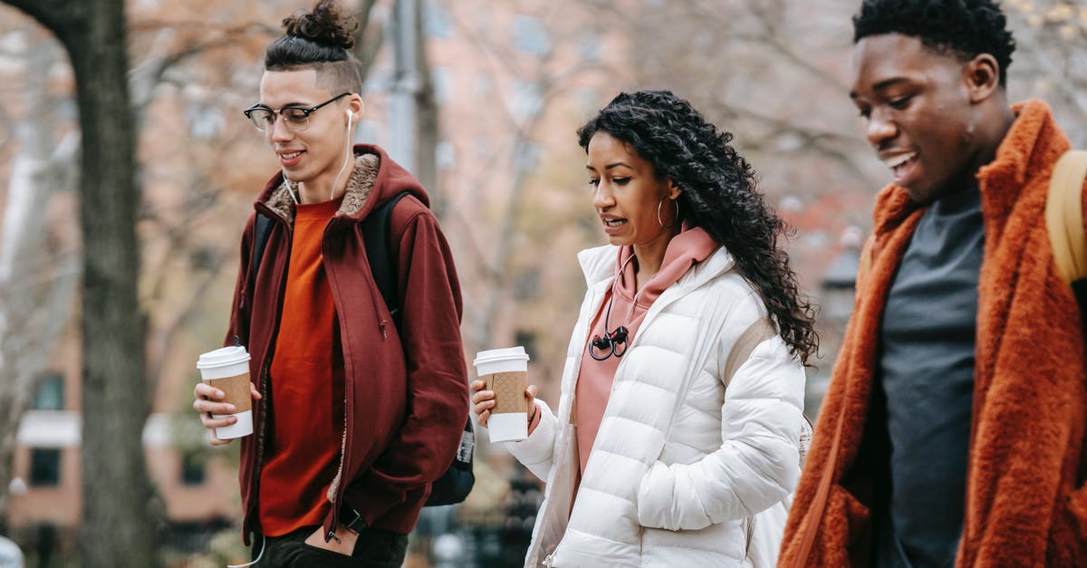 Does Kombucha Tea spoil if left outside of refrigeration? - Group of multiethnic students walking on street with coffee cups Does Kombucha Tea spoil if left outside of refrigeration? - Group of multiethnic students walking on street with coffee cups